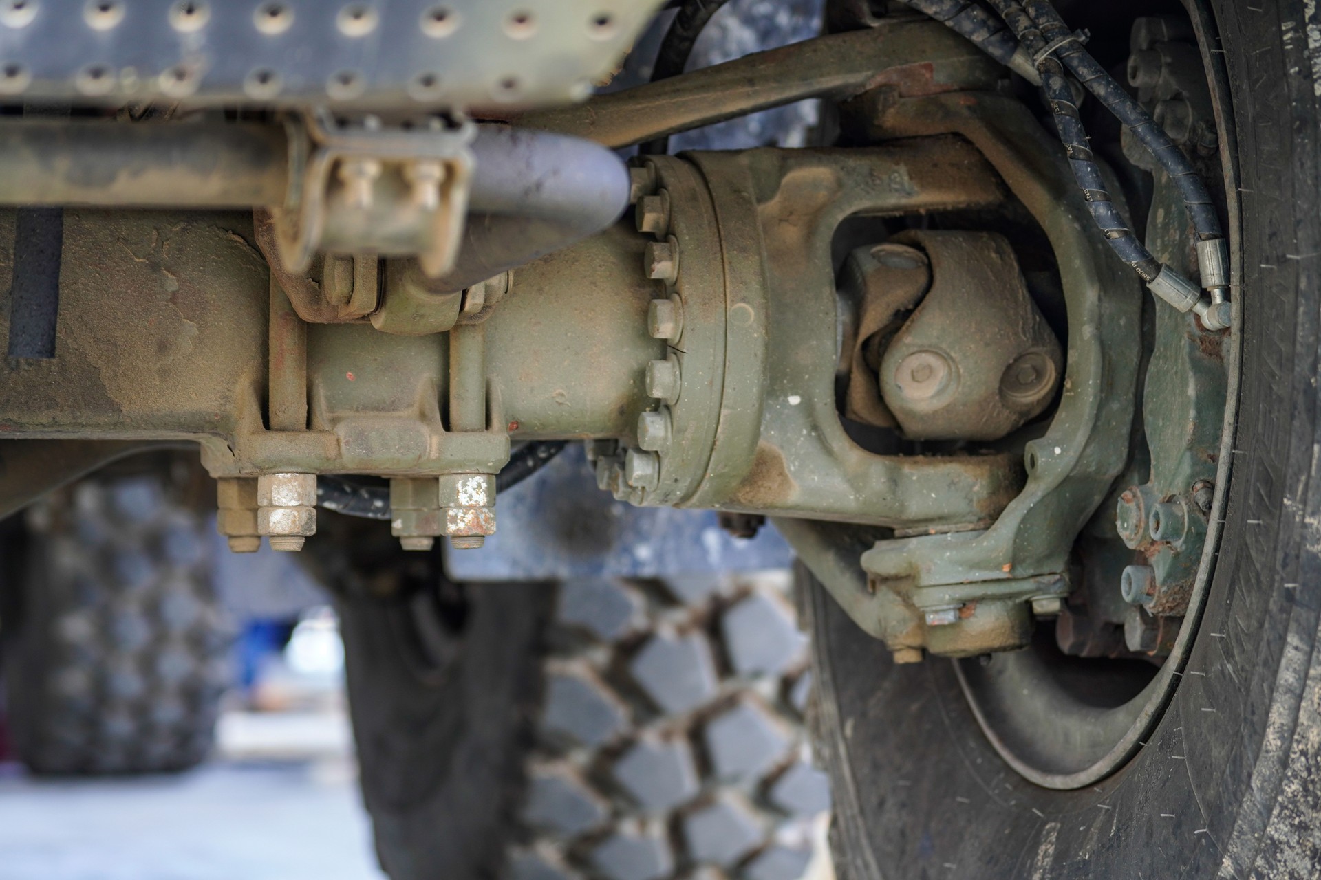 Double cardan shaft and wheel drive mechanism on truck, close up of heavy vehicle transmission system
